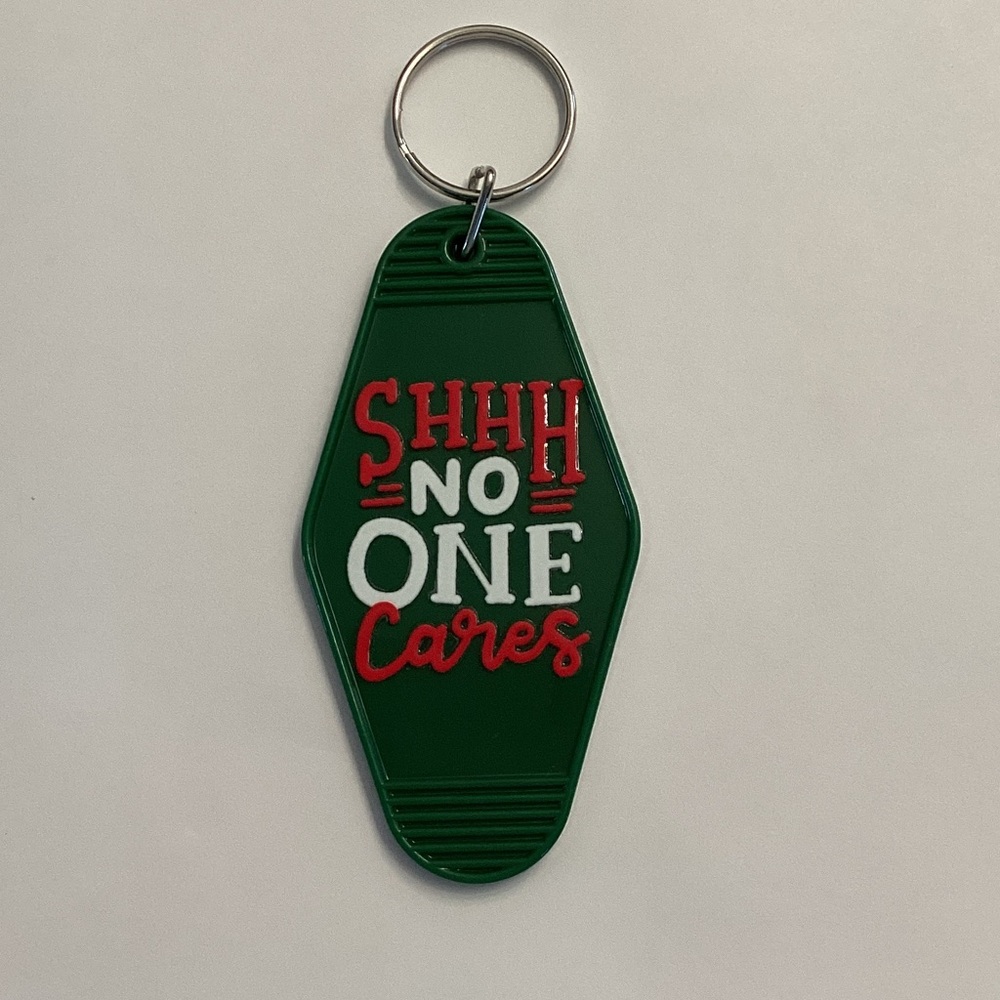 Green Keychain with Red and White Text